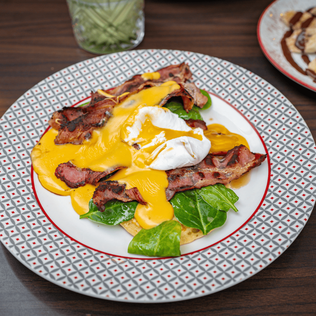 plate with bacon and egg